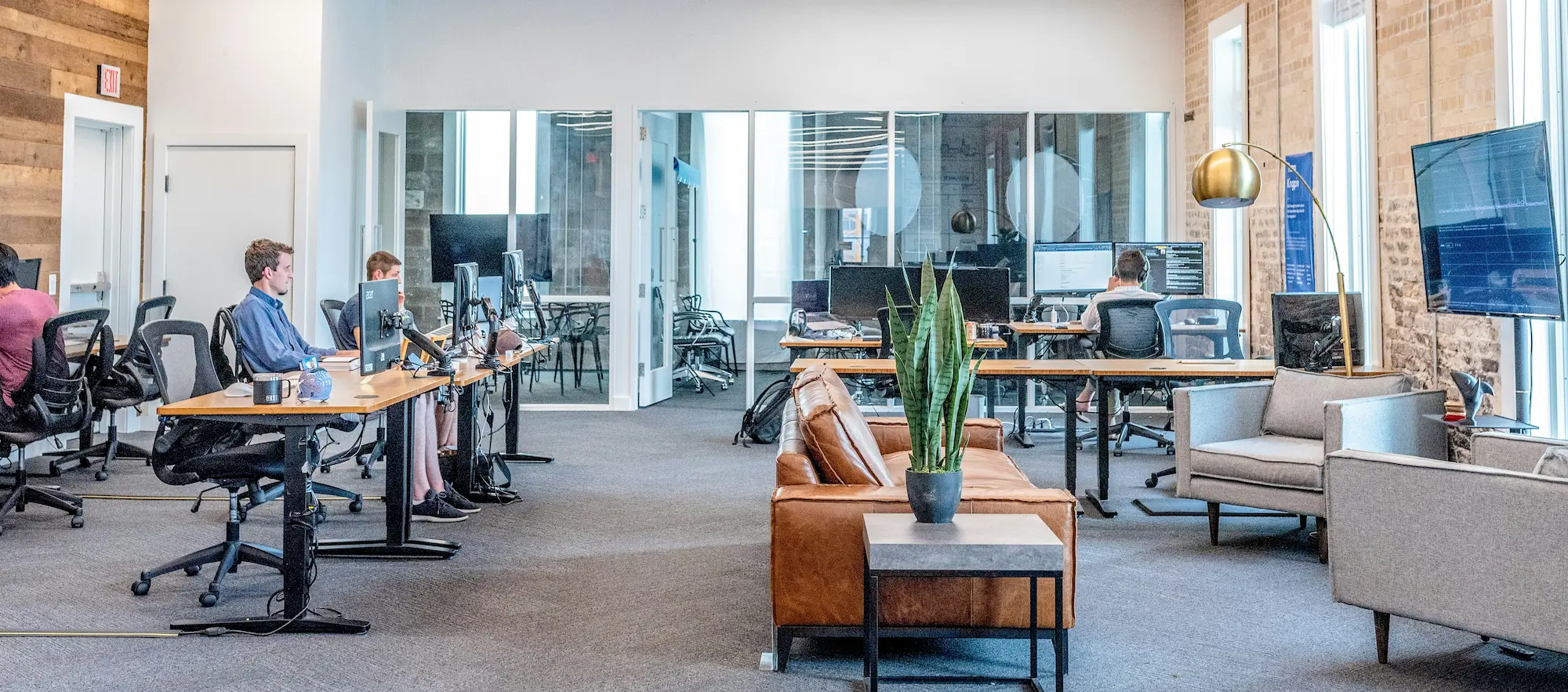 People working form computers in an office block | Cyber essentials plus certification